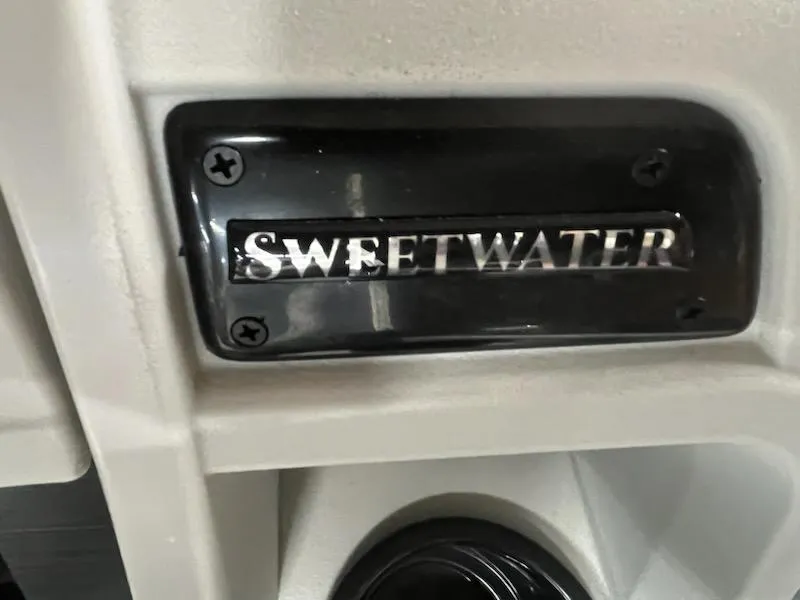 Slide: The Image of Sweetwater 2286SB 2025 model nameplate on a sleek black and white surface. - 20