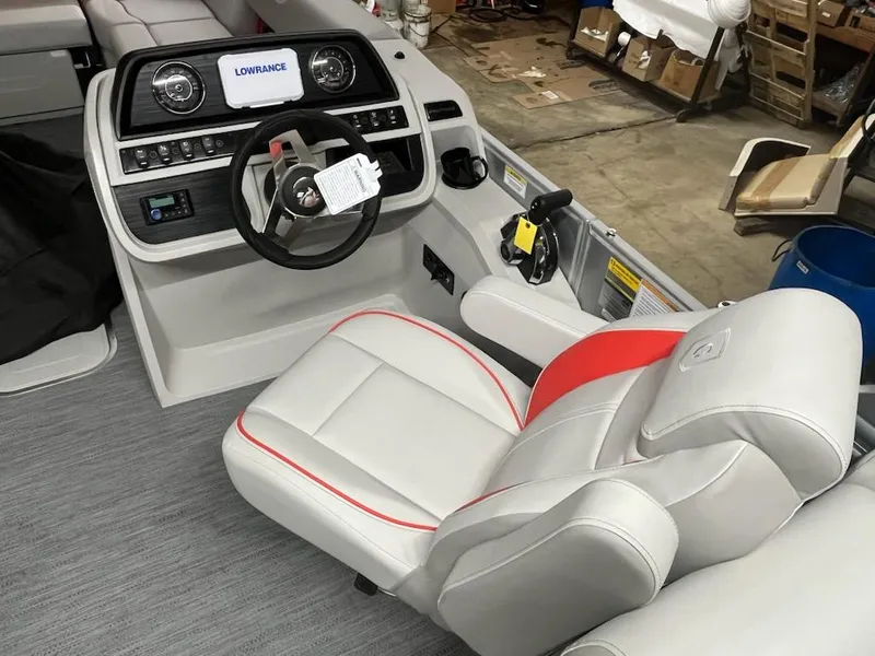 Slide: The Image of 2025 Sweetwater 2286SB boat interior with modern dashboard and comfortable seating. - 7