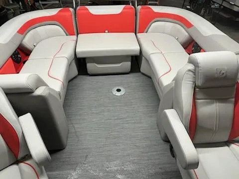 Slide: The Image of 2025 Sweetwater 2286SB boat interior with red and gray seating, spacious and modern design. - 9