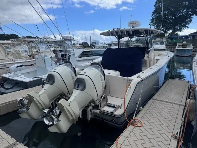 The Image of 2008 Grady-White 336 Canyon boat docked with twin outboard engines. - 1