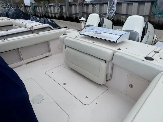 Slide: The Image of 2008 Grady-White 336 Canyon boat interior with seating and storage, docked at marina. - 22
