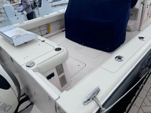 Slide: The Image of 2008 Grady-White 336 Canyon boat deck with covered seating and fishing rod holders. - 25