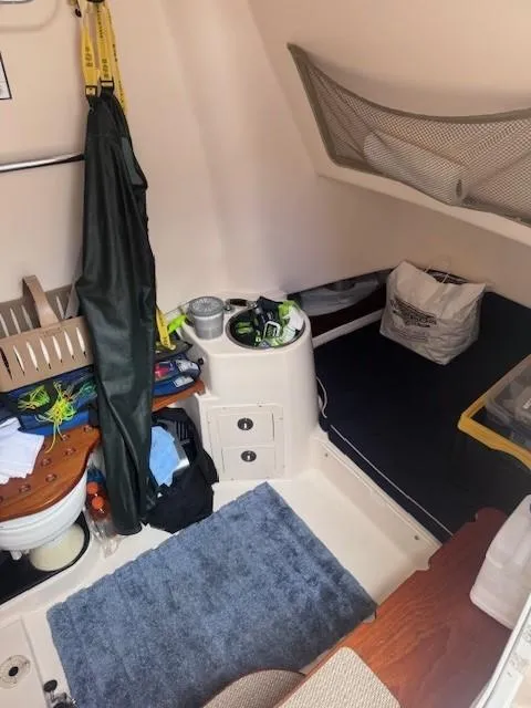 Slide: The Image of Interior of 2008 Grady-White 336 Canyon boat with storage and seating area. - 30