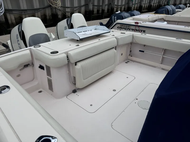 Slide: The Image of 2008 Grady-White 336 Canyon boat interior with seating and equipment, docked at marina. - 35