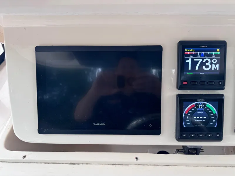Slide: The Image of Garmin navigation display on 2008 Grady-White 336 Canyon boat dashboard. - 43
