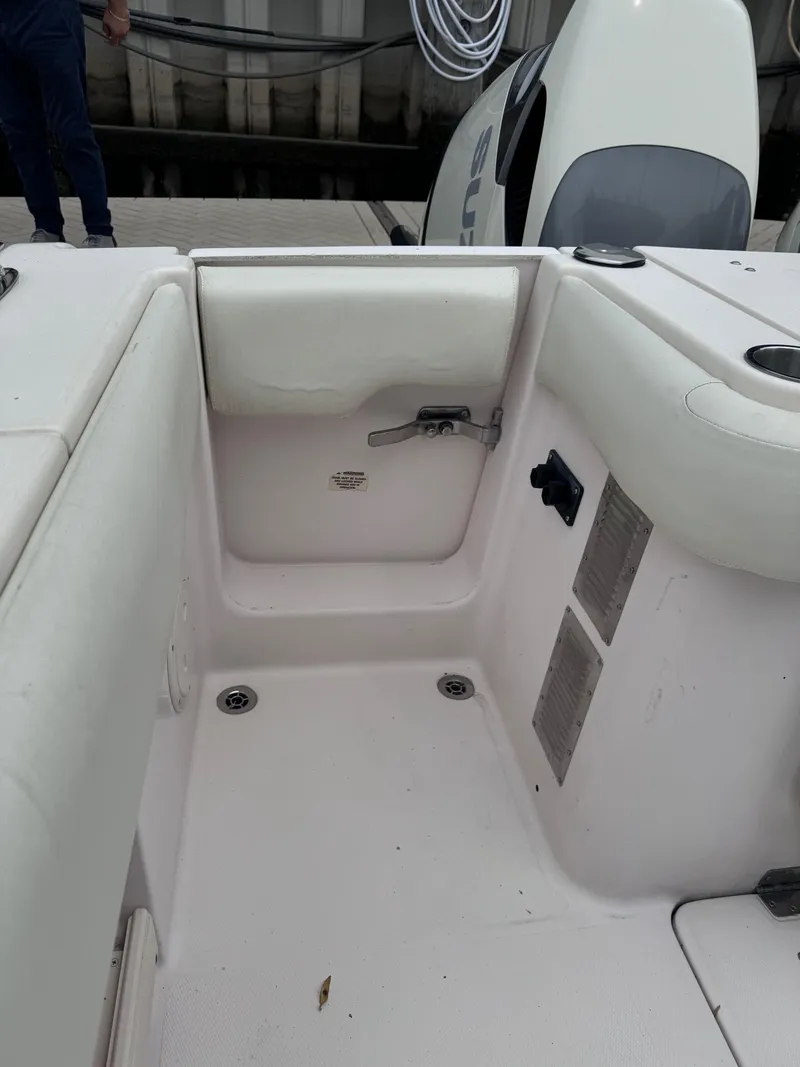 Slide: The Image of 2008 Grady-White 336 Canyon boat interior with seating and engine view. - 47