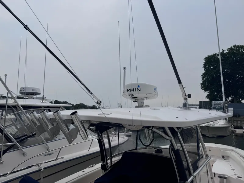 Slide: The Image of 2008 Grady-White 336 Canyon boat with Garmin radar, docked in a marina. - 48