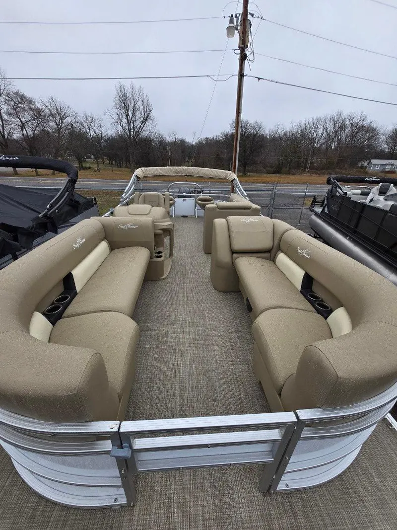 Slide: The Image of 2025 G3 SELECT 322SS pontoon boat with spacious beige seating and open deck layout. - 10