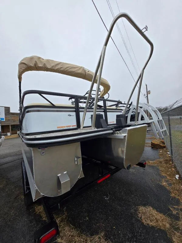 Slide: The Image of 2025 G3 SELECT 322SS pontoon boat on trailer, rear view, overcast day. - 11