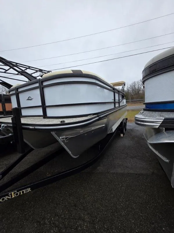 Slide: The Image of 2025 G3 SELECT 322SS pontoon boat on trailer, parked outdoors. - 12