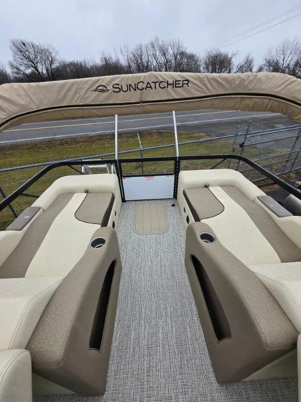 Slide: The Image of 2025 G3 SELECT 322SS pontoon boat interior with beige seating and "Suncatcher" canopy. - 3