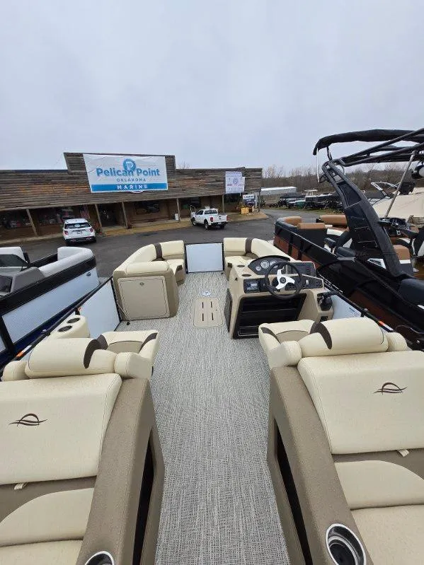 Slide: The Image of 2025 G3 SELECT 322SS pontoon boat interior with beige seating at Pelican Point Marina. - 4