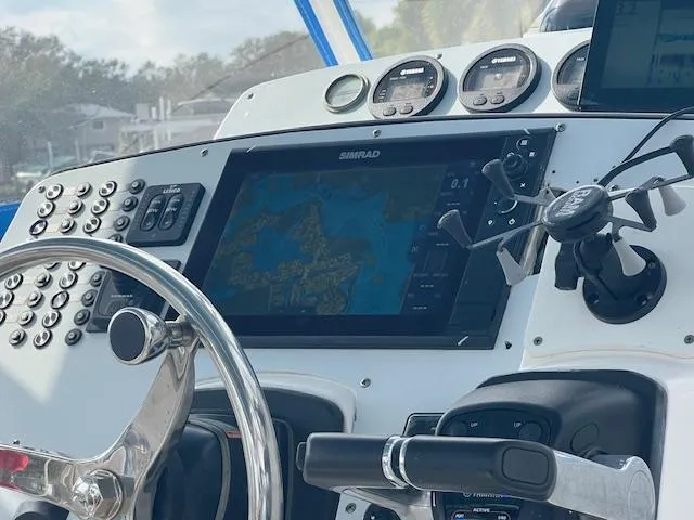 Slide: The Image of 2008 Fountain 33 SFC Sportfish Cruiser dashboard with navigation system and controls. - 12
