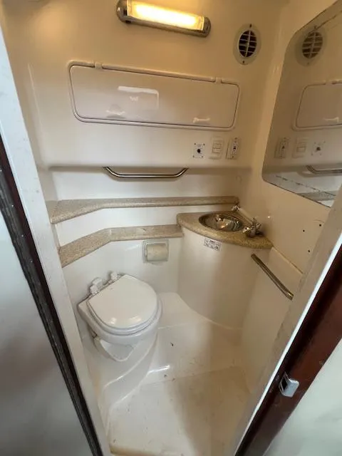 Slide: The Image of 2008 Fountain 33 SFC Sportfish Cruiser bathroom with toilet and sink. - 17
