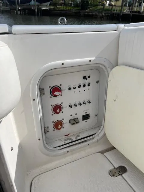 Slide: The Image of Control panel on 2008 Fountain 33 SFC Sportfish Cruiser, featuring various switches and gauges. - 18