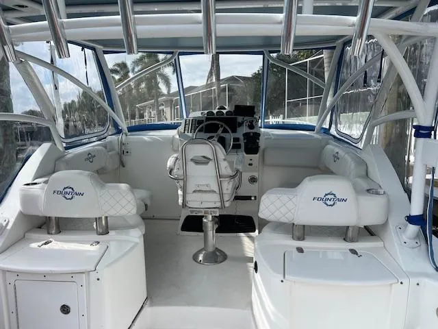 Slide: The Image of 2008 Fountain 33 SFC Sportfish Cruiser interior with helm and seating. - 9