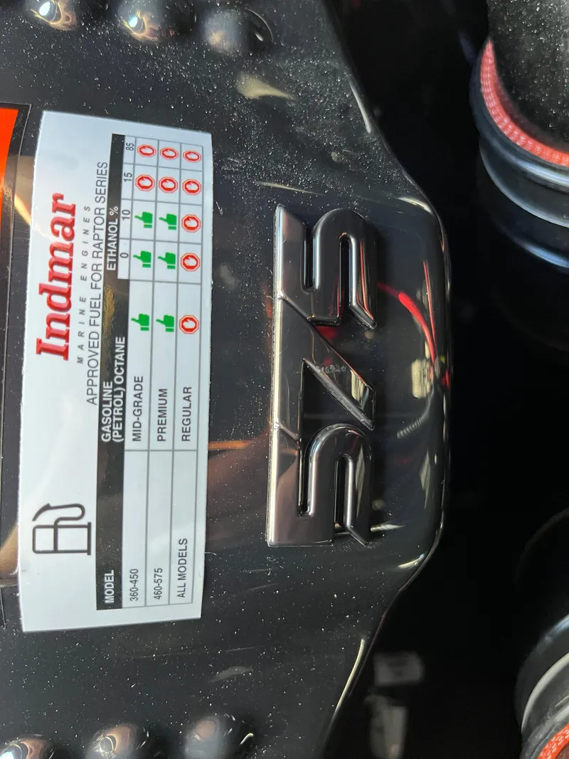 Slide: The Image of Close-up of 2025 Supra SE engine with Indmar fuel specifications label. - 10