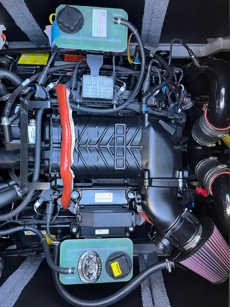 Slide: The Image of 2025 Supra SE engine, detailed view of components and wiring. - 11