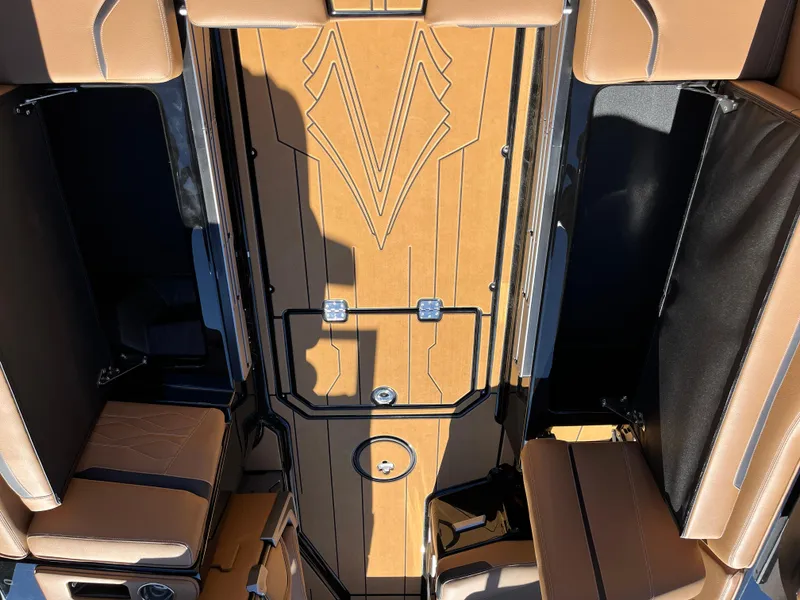 Slide: The Image of 2025 Supra SE interior with tan and black seating, featuring sleek design and modern finishes. - 12