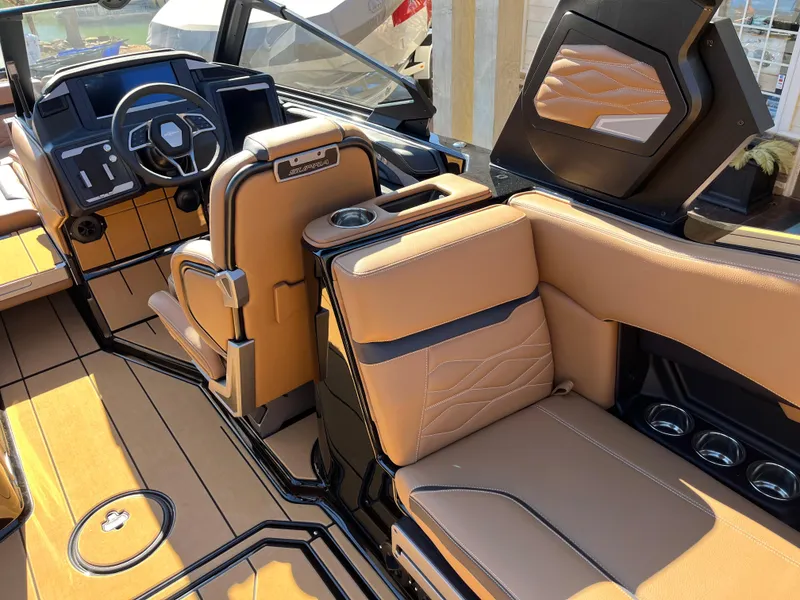Slide: The Image of 2025 Supra SE boat interior with luxurious tan leather seating and modern dashboard design. - 17