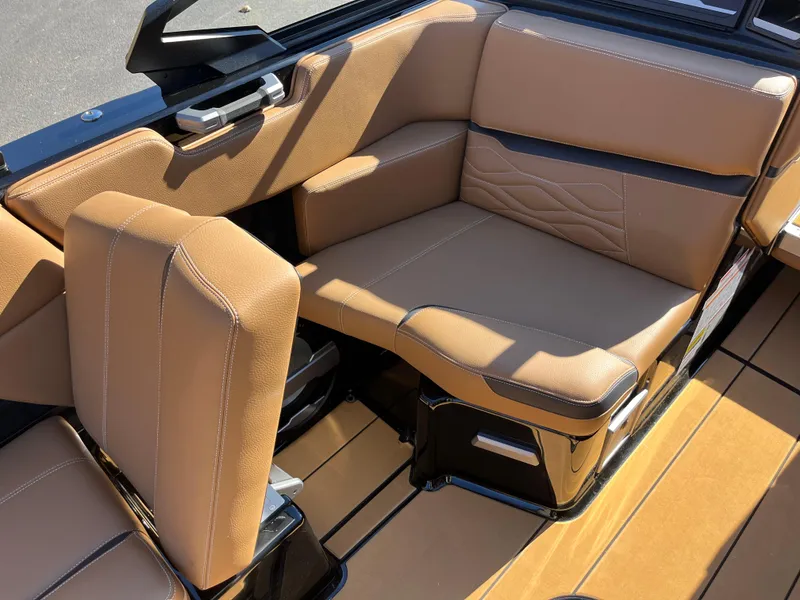 Slide: The Image of 2025 Supra SE boat interior with tan leather seating and modern design. - 18