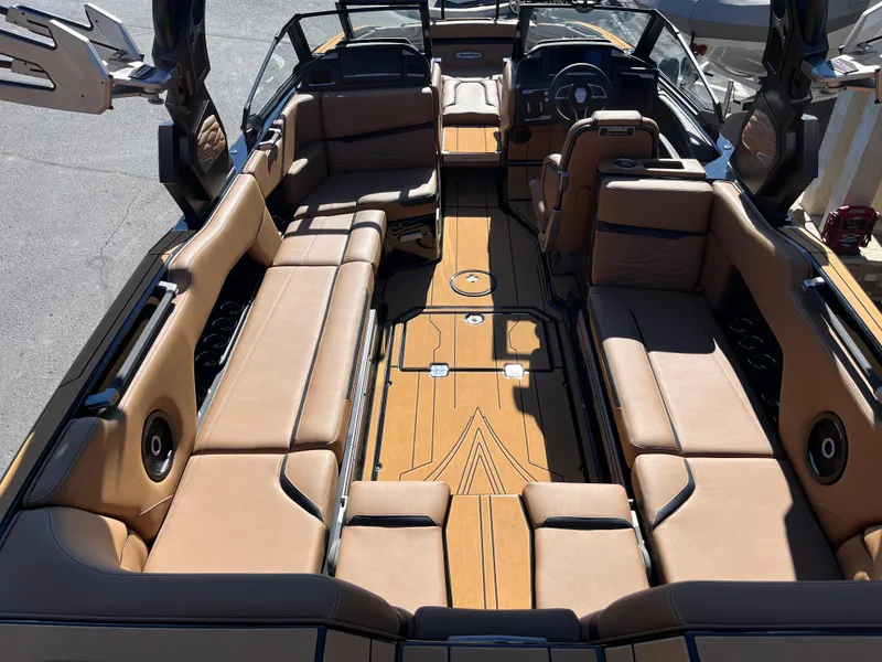 Slide: The Image of 2025 Supra SE boat interior with tan leather seating and sleek design. - 21