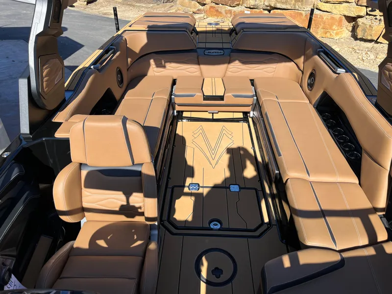 Slide: The Image of 2025 Supra SE boat interior with luxurious tan leather seating and modern design. - 24
