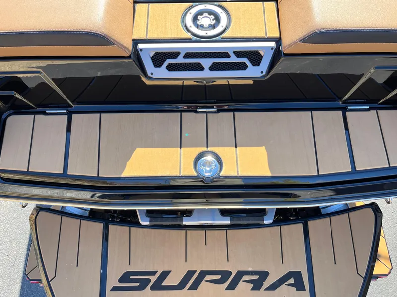 Slide: The Image of 2025 Supra SE boat deck with logo, featuring sleek design and premium materials. - 34