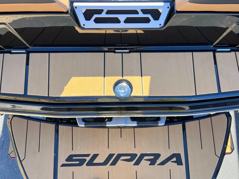 Slide: The Image of 2025 Supra SE boat deck with logo, featuring sleek design and premium materials. - 7