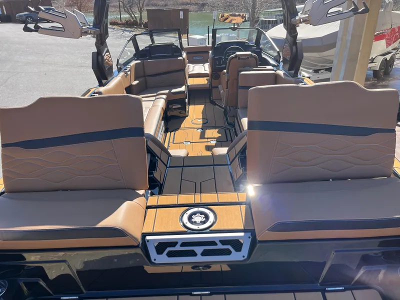 Slide: The Image of 2025 Supra SE boat interior with tan leather seats and modern design. - 8