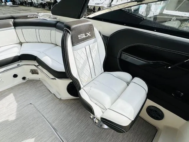 Slide: The Image of Luxurious interior of 2016 Sea Ray 250 SLX boat with plush seating and modern design. - 16