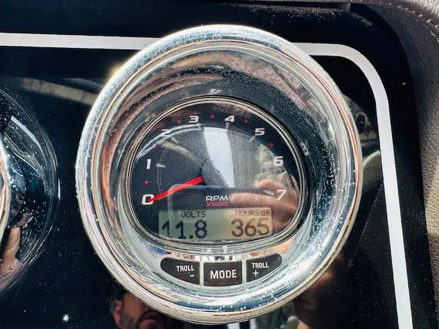 Slide: The Image of Close-up of 2016 Sea Ray 250 SLX boat tachometer displaying RPM and voltage. - 24