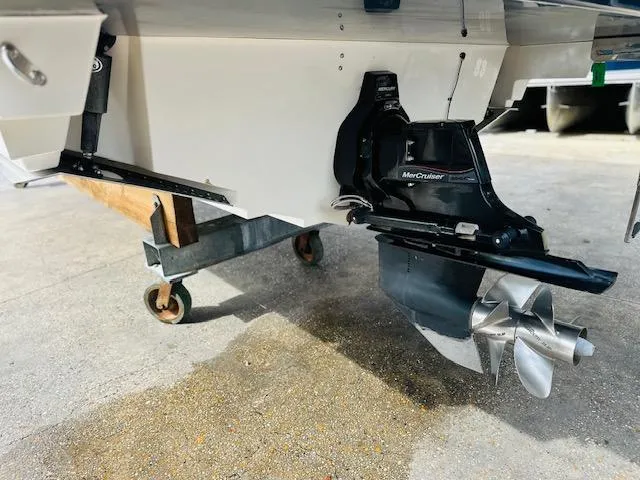 Slide: The Image of 2016 Sea Ray 250 SLX boat with MerCruiser outdrive on a wheeled stand. - 8