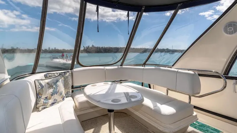 Slide: The Image of Luxurious interior of 2006 Sea Ray 44 Sedan Bridge yacht with panoramic windows. - 2