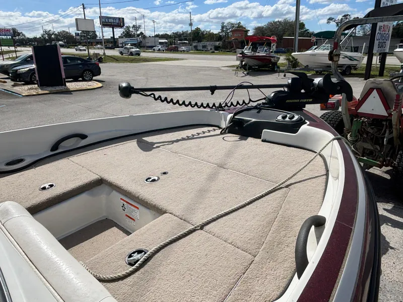 Slide: The Image of 2015 Nitro Z-7 Sport boat with trolling motor in a parking lot. - 10