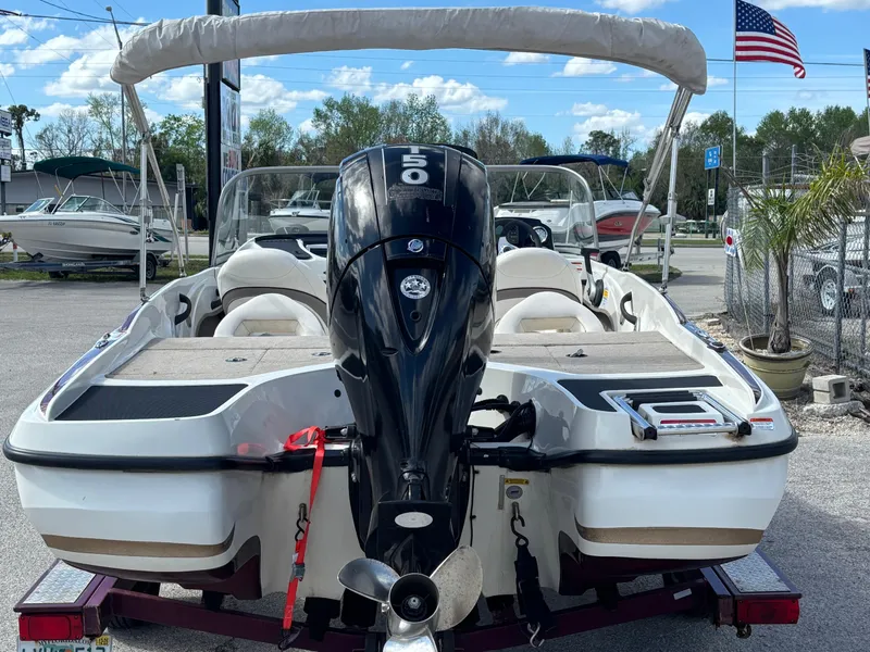 Slide: The Image of 2015 Nitro Z-7 Sport boat with powerful outboard motor, parked on a trailer. - 13
