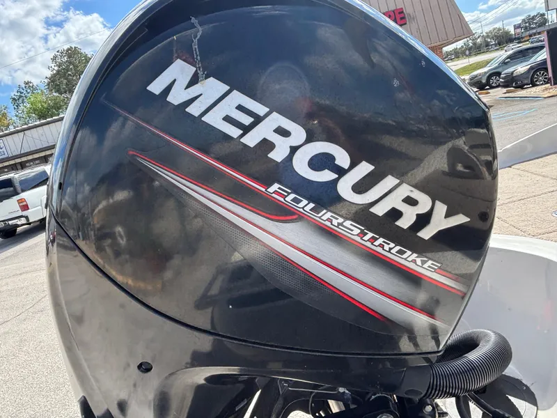 Slide: The Image of Mercury FourStroke engine on 2015 Nitro Z-7 Sport boat, outdoor setting. - 15