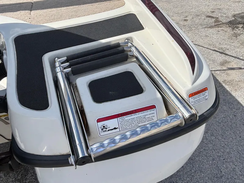 Slide: The Image of 2015 Nitro Z-7 Sport boat ladder with safety warnings and non-slip surface. - 16