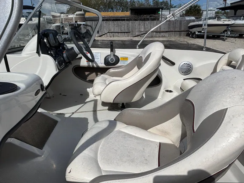 Slide: The Image of Interior of 2015 Nitro Z-7 Sport boat with white seating and control panel. - 22