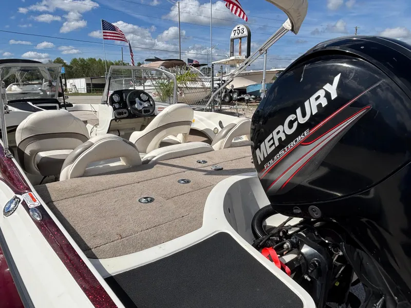 Slide: The Image of 2015 Nitro Z-7 Sport boat with Mercury engine, American flags in background. - 24