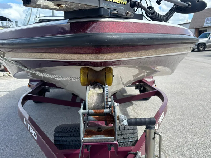 Slide: The Image of 2015 Nitro Z-7 Sport boat on trailer, front view, maroon color. - 6