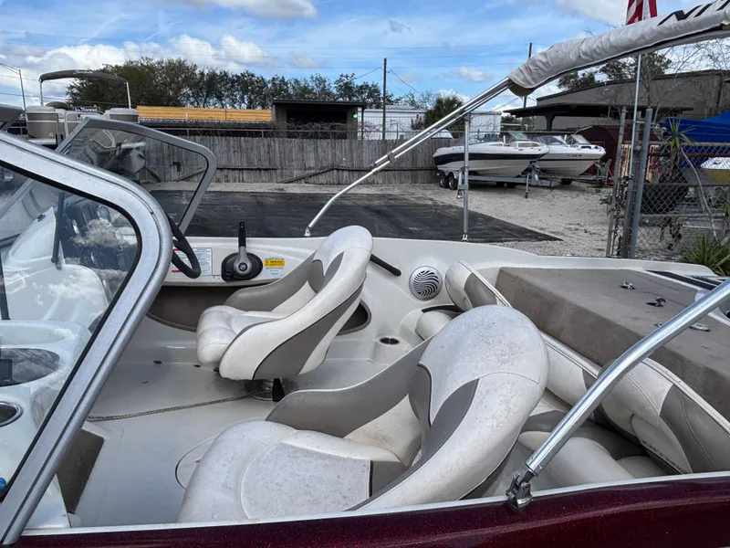 Slide: The Image of 2015 Nitro Z-7 Sport boat interior with white seats and steering wheel. - 7