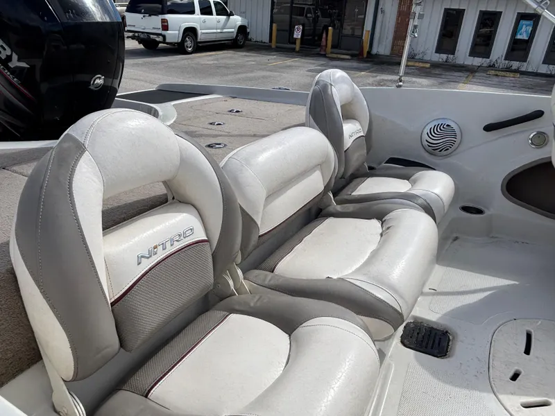 Slide: The Image of 2015 Nitro Z-7 Sport boat interior with white and gray seating. - 8
