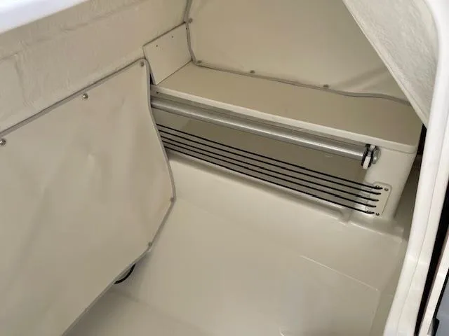 Slide: The Image of 2025 Bayliner TROPHY 22 SC interior storage compartment, featuring sleek design and ample space. - 13