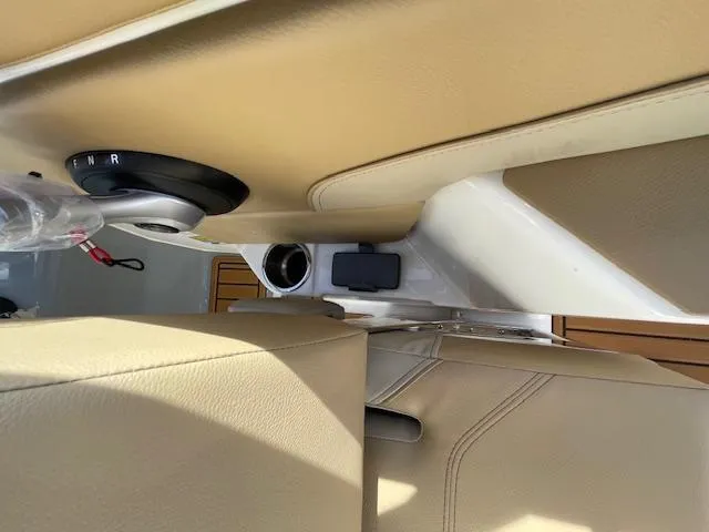 Slide: The Image of Interior view of 2025 Bayliner TROPHY 22 SC boat with beige seating and control panel. - 31