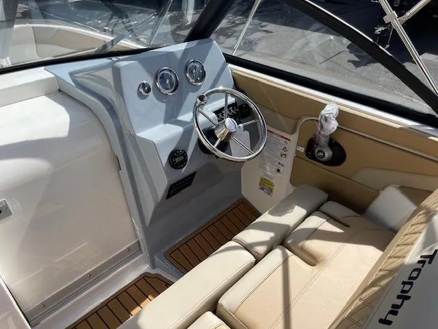 Slide: The Image of 2025 Bayliner TROPHY 22 SC boat interior with steering wheel and seating. - 9