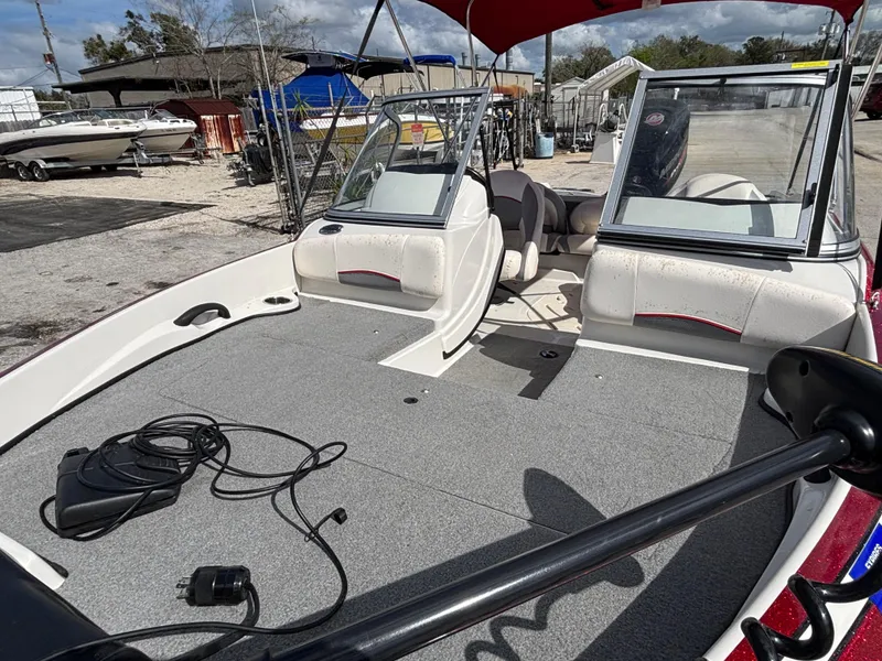 Slide: The Image of 2014 Nitro Z-7 boat interior with seating and equipment, parked on a trailer. - 13