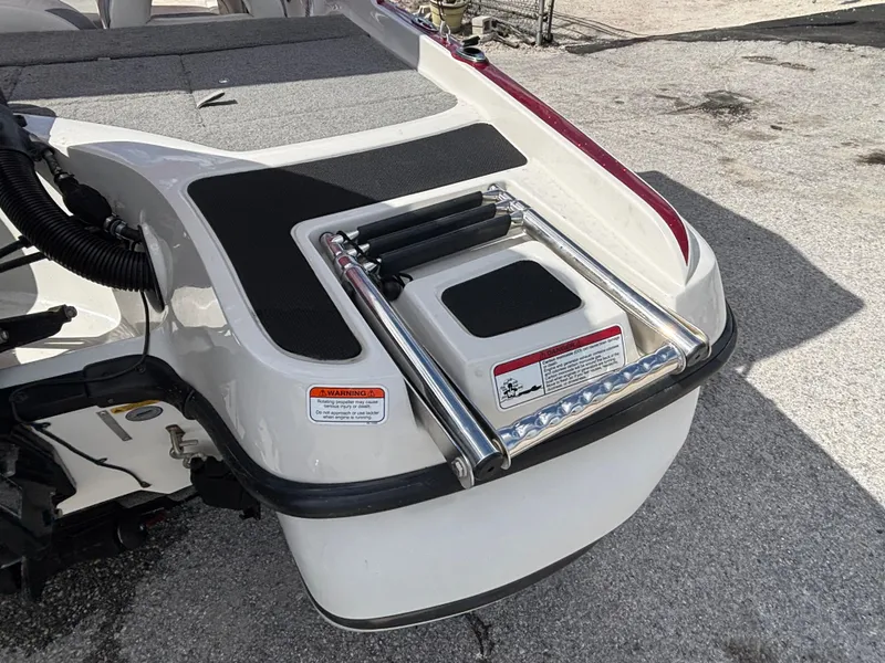 Slide: The Image of 2014 Nitro Z-7 boat rear view with ladder and trailer. - 22