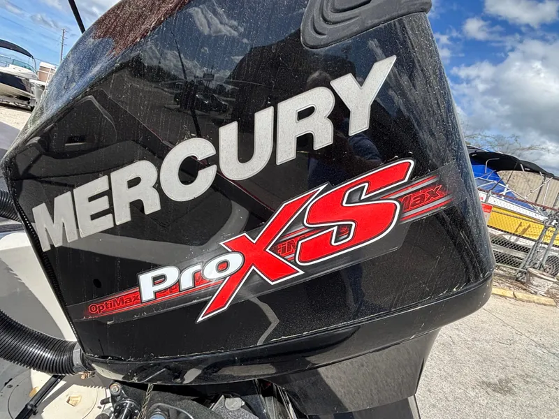 Slide: The Image of Mercury Pro XS engine on 2014 Nitro Z-7 boat, outdoor setting. - 24