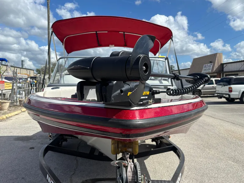 Slide: The Image of 2014 Nitro Z-7 boat with 150 L OptiMax Pro XS, red canopy, on trailer. - 7